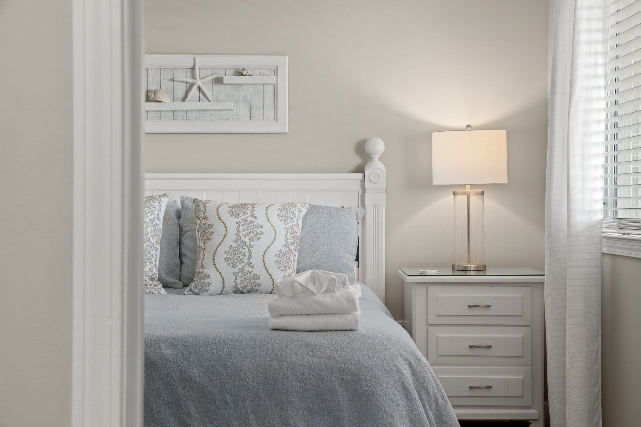 Additional bedroom w/ neutral tones and a calm, uncluttered layout