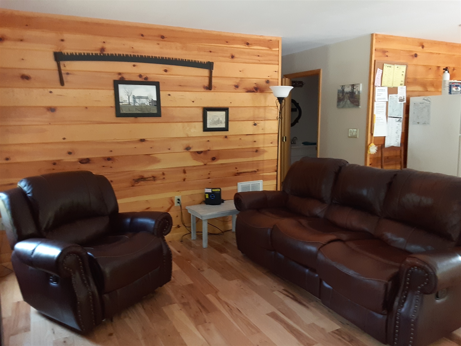 The living room is warm and inviting, with a cozy, rustic feel that makes it easy to relax after a day in the mountains.