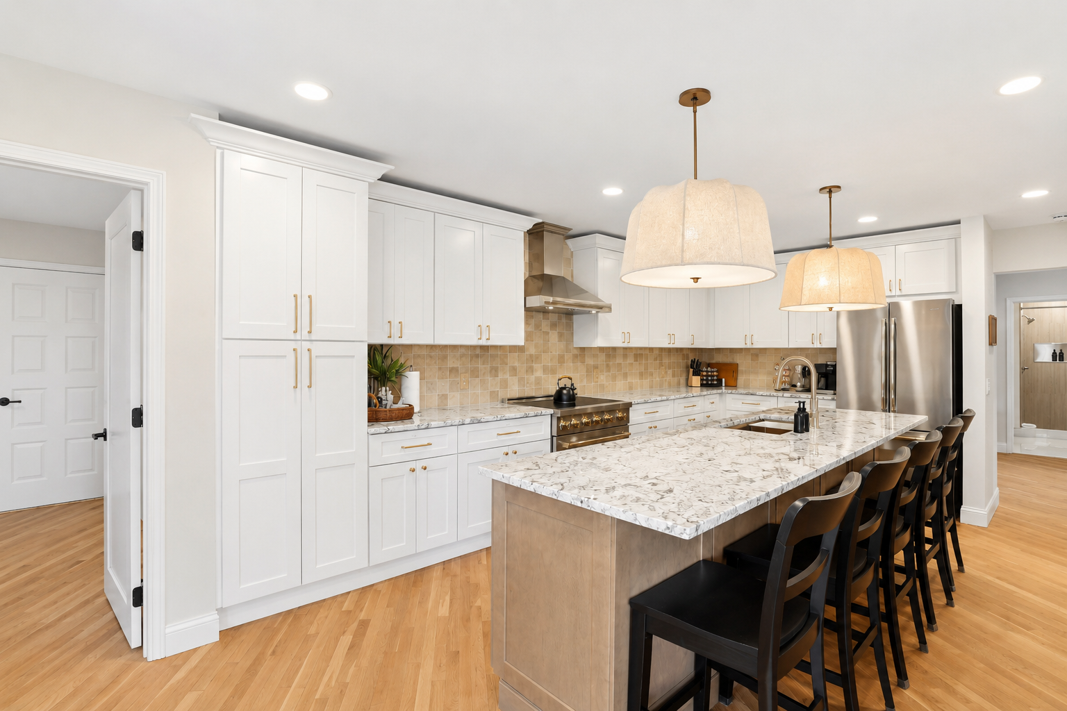Prepare meals with ease in this beautifully updated kitchen featuring a large granite island, premium appliances, and seating for the whole group. The open layout provides plenty of space to cook, dine, and connect, making it the heart of the home.