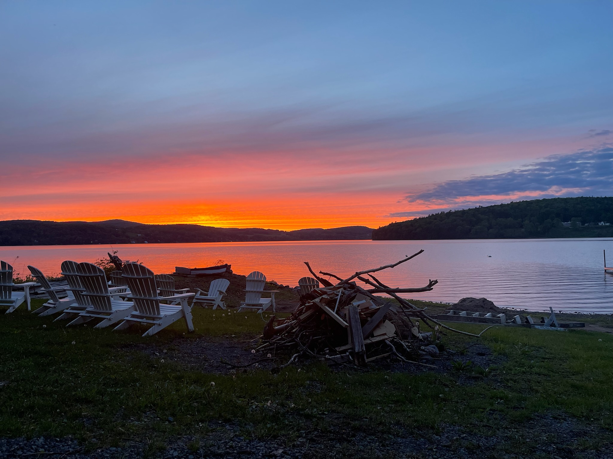 Camp fire ready to be started at water's edge