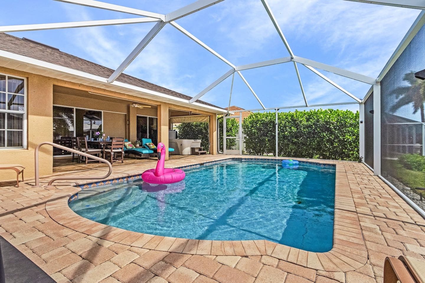 Enjoy ultimate relaxation with a spacious pool, hot tub, and tranquil Water view backdrop!