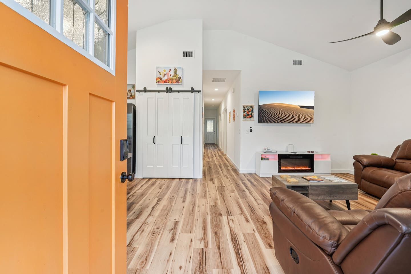 Step inside to an open concept house with large dining table and large couches so everyone can gather together.