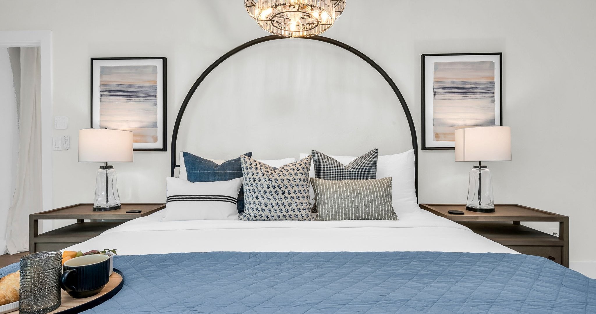 This second primary suite offers a plush king bed, private ensuite bathroom, and walk-in closet for added comfort. Enjoy poolside views and direct access to the outdoor living area, making it the perfect blend of luxury and convenience.