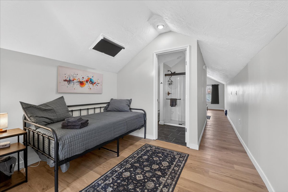 A cozy twin daybed on the second floor. It's separated from the third king room with a hallway (but no door), and it's next to the second full bathroom.