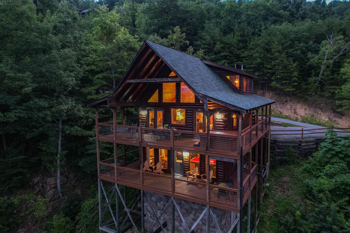 Above the Mist features 3 floors with a bedroom / bath on each level. The wrap around decks allow for plenty of room for you and your group to enjoy the views inside and out.
