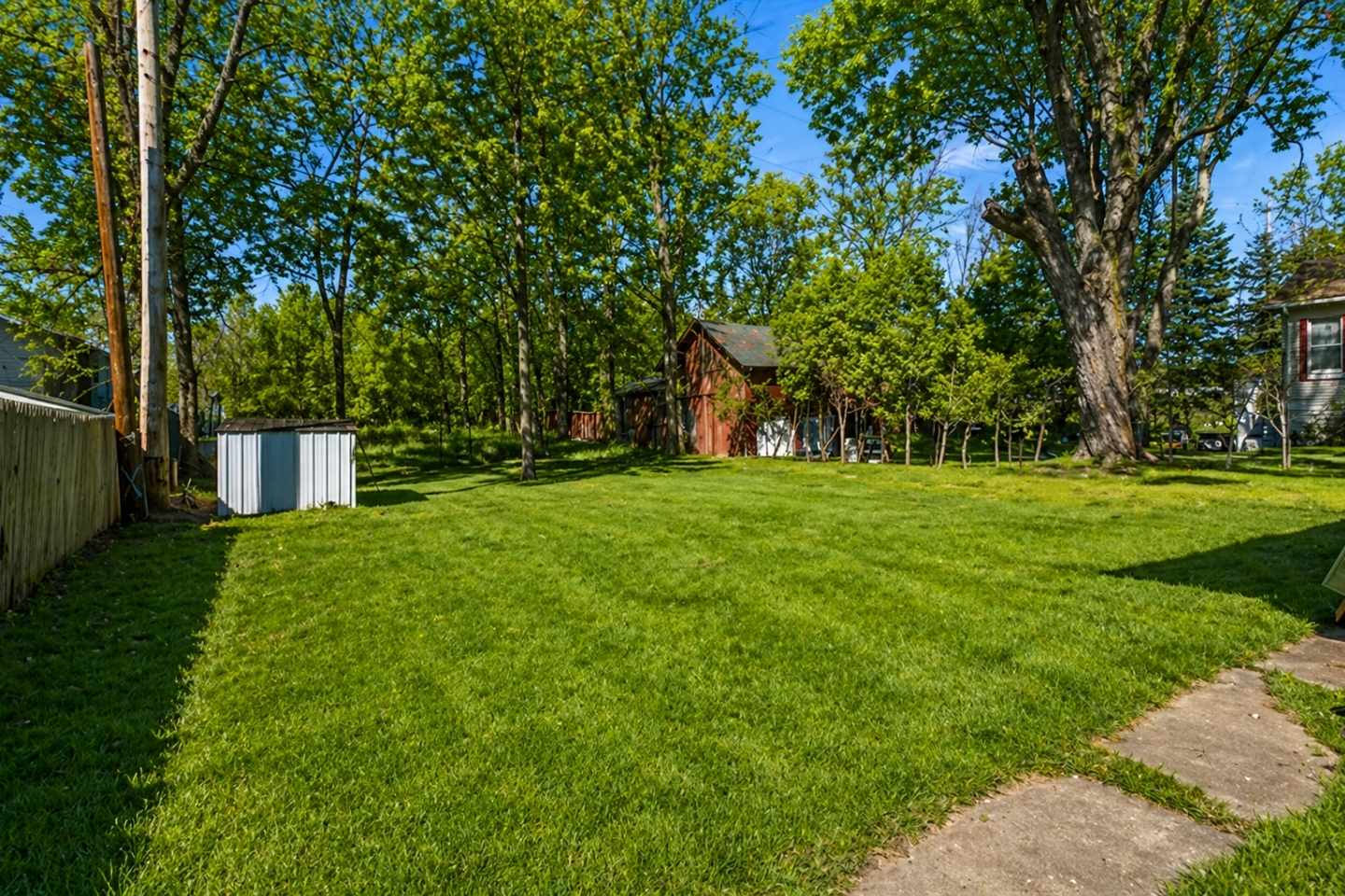 Bask in the spacious backyard oasis, ideal for gatherings or a tranquil morning amid nature's embrace.