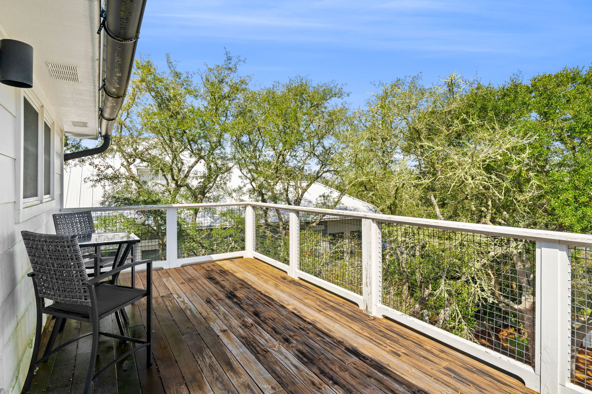 3rd Floor: A private sun-drenched deck with peaceful lakeside views.