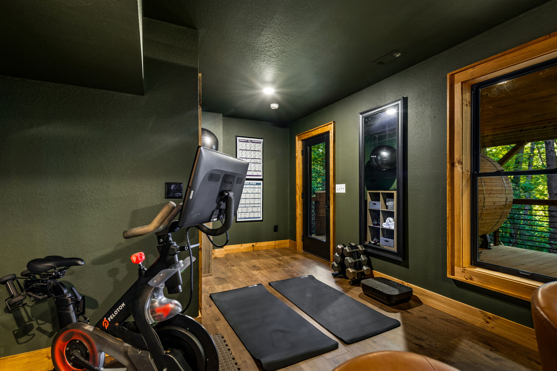 Gym with Peleton, free weights, vibration plate, yoga mats and yoga ball