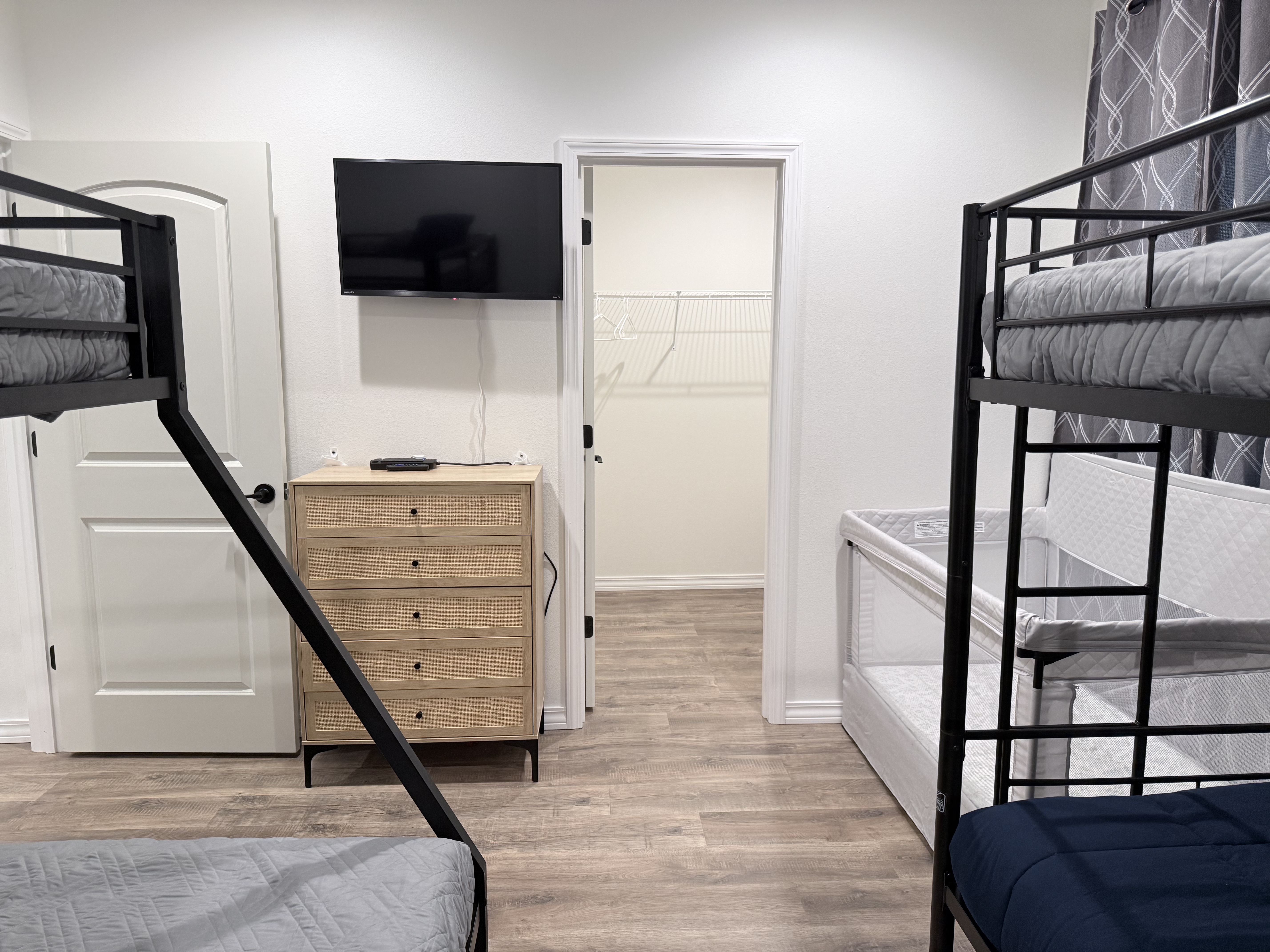 View from bunk bed area toward TV. Lots of floor space to move around.