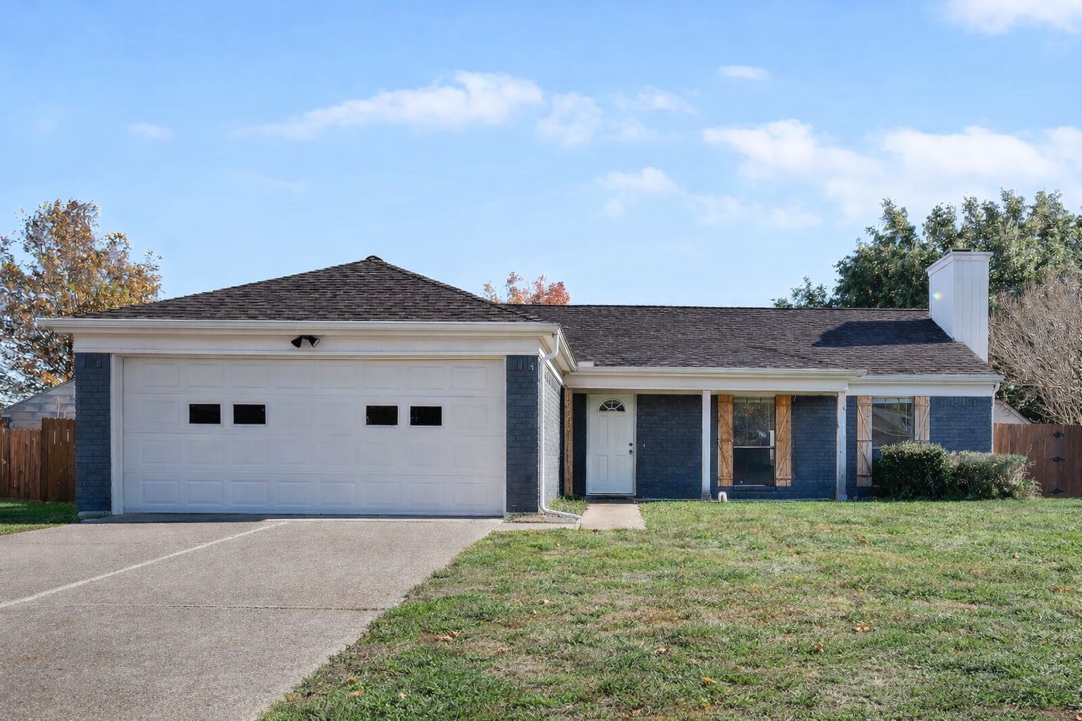 The house boasts 2 garage spaces and a large driveway with plenty of space for your vehicles.