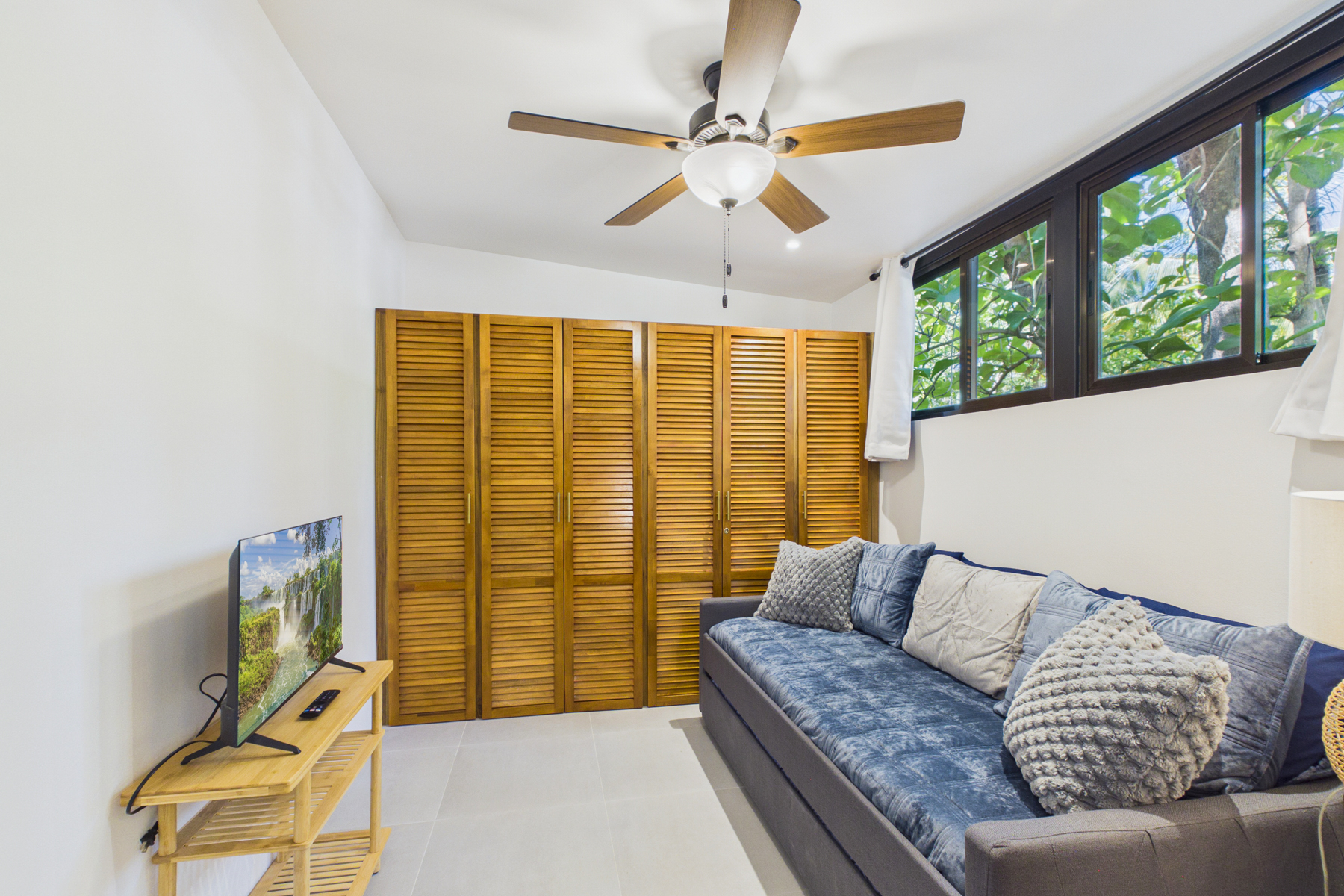 Private sitting area off bedroom 3 OR additional bedroom 5 as a kid bedroom.  Twin over twin trundle can be used as a sitting sofa, two twin beds, or one king bed.  Smart tv and AC.  Barn doors can be open to bedroom 3 or closed for privacy.  