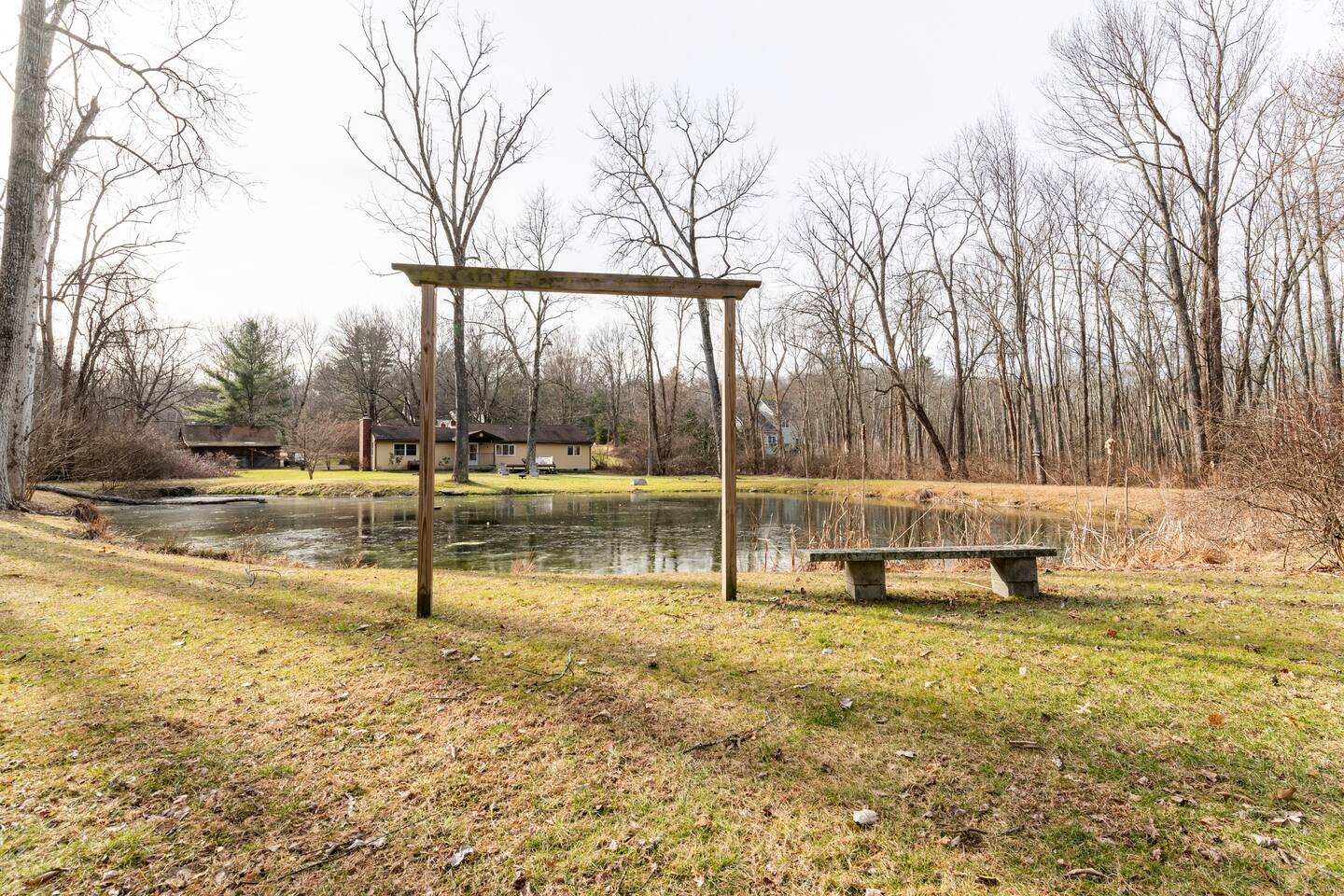 Opposite side of pond with small seating and picture area.