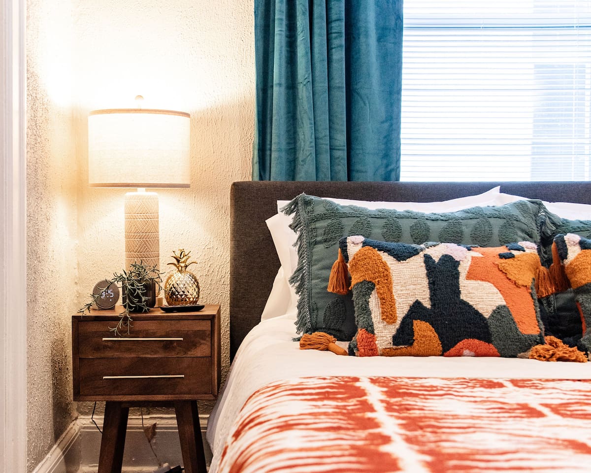 Charming bedside table with a sleek design, offering convenient storage for your essentials like a lamp, books, or your phone.