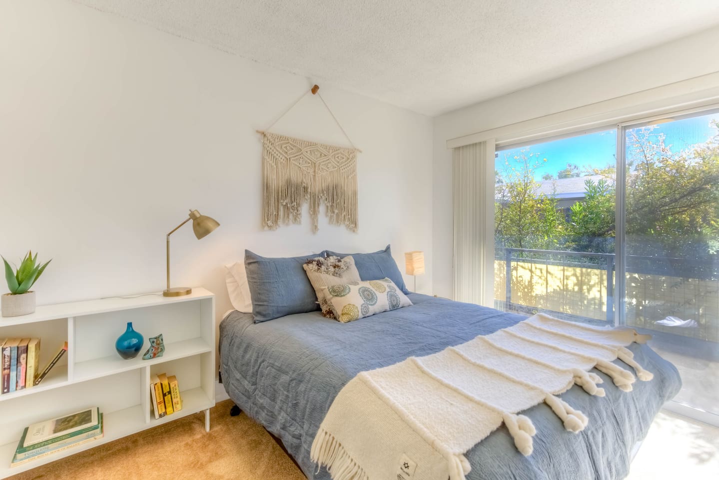 queen bed with slider to balcony, room darkening shades