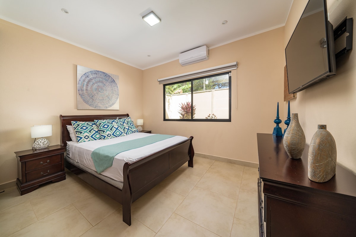 3rd bedroom equipped with a bed, smart TV and large closet space