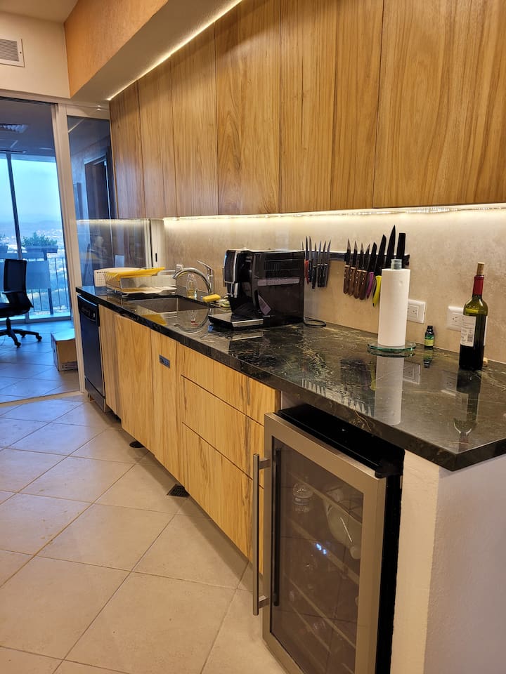 Gourmet kitchen with office area at the back.