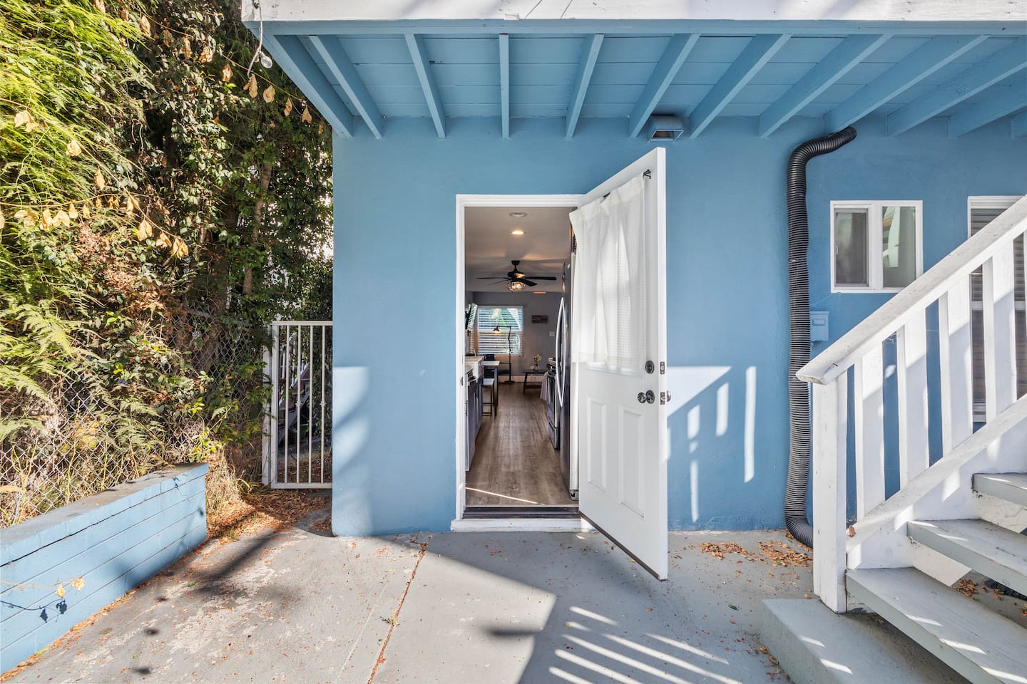 Welcoming exterior showcasing the entrance of the house, designed to captivate guests with its charm. The inviting doorway hints at the delightful interiors waiting inside, creating an enchanting first impression that promises a cozy retreat.