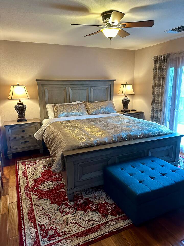 Master bedroom - king size bed and single sleeper with access to the patio