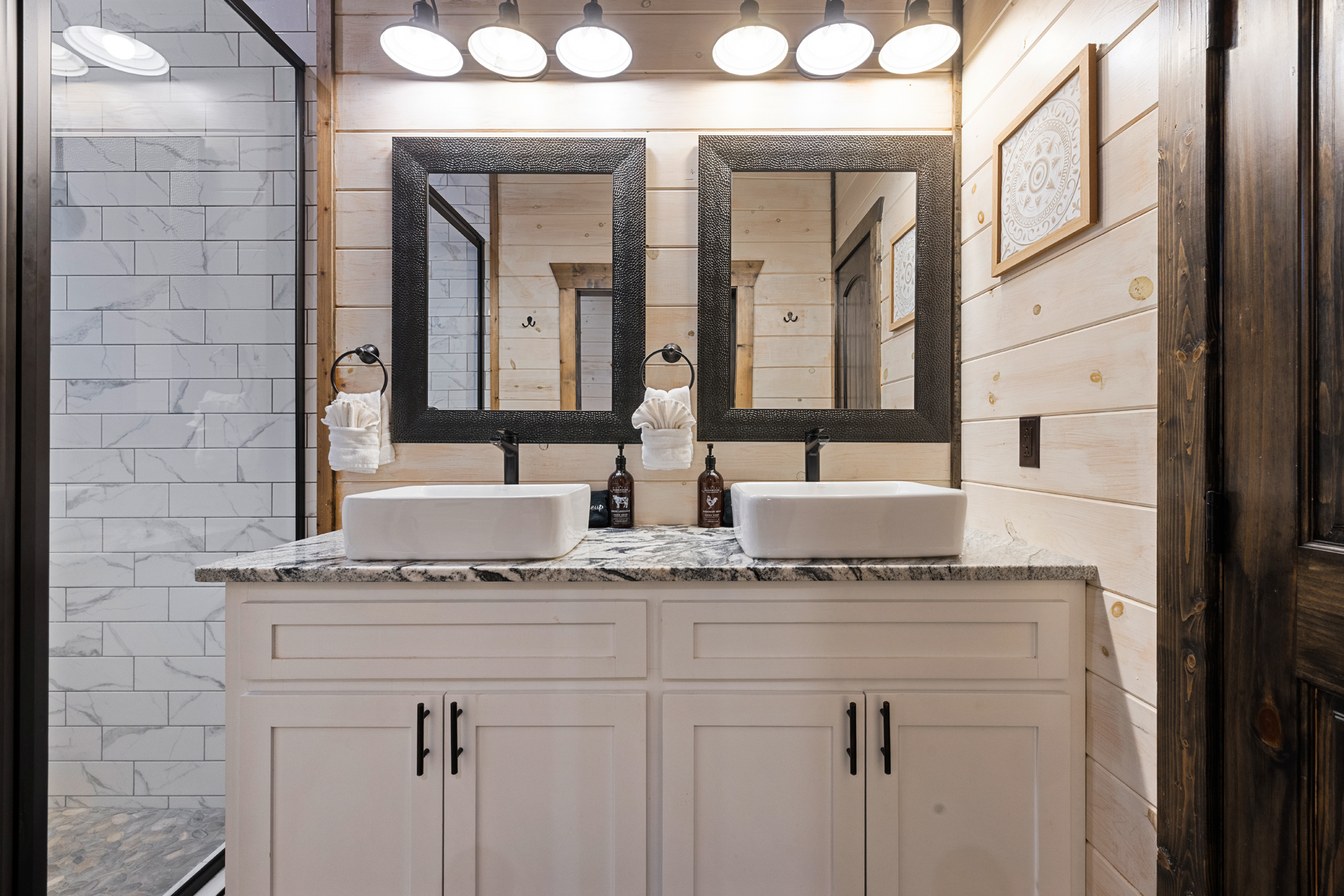 Ensuite bathroom with double vanities and luxury and spacious standing showers in both king bedrooms and bunkhouse!