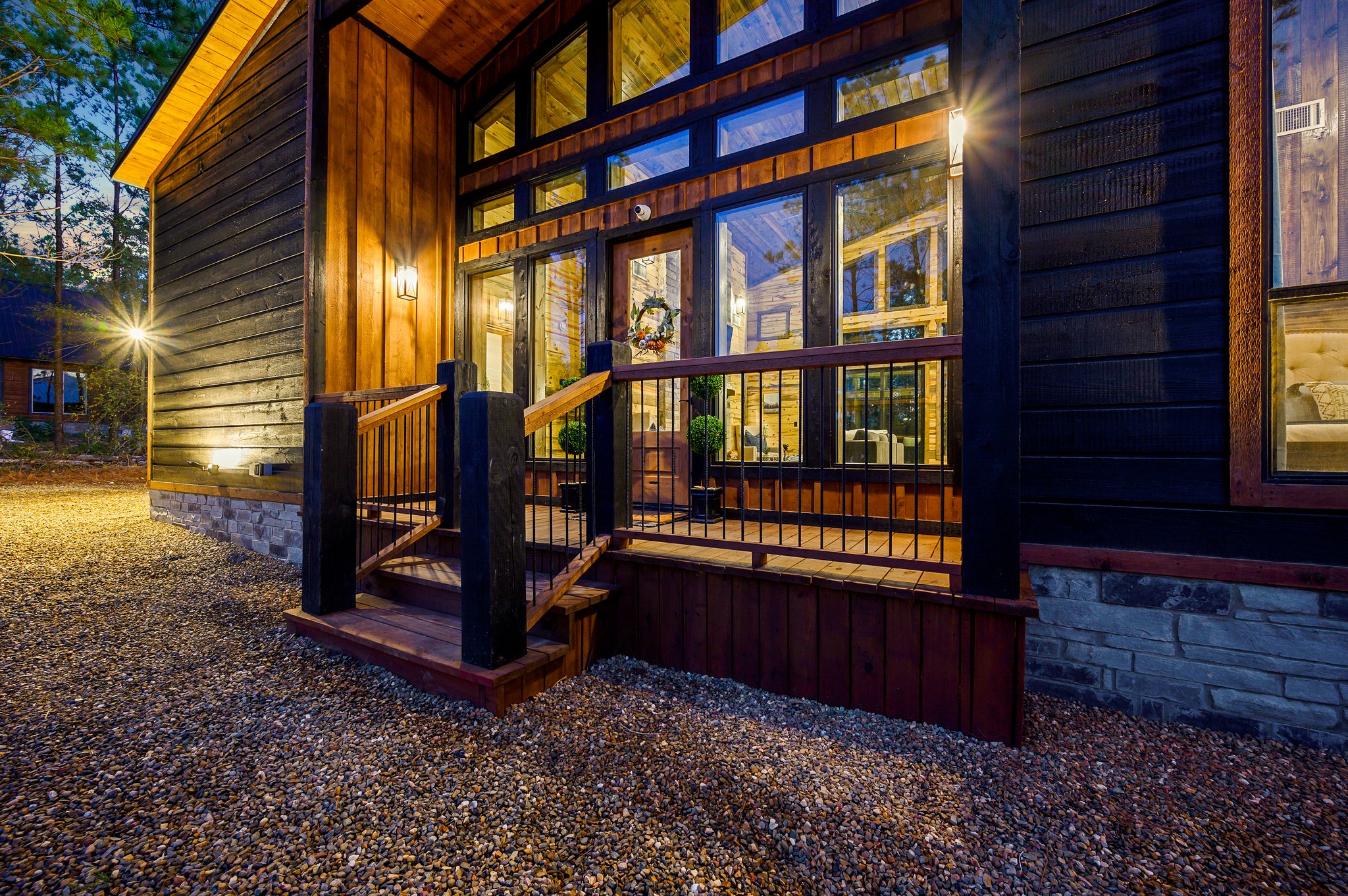 Step into luxury: Grand glass entrance and warm timber accents.