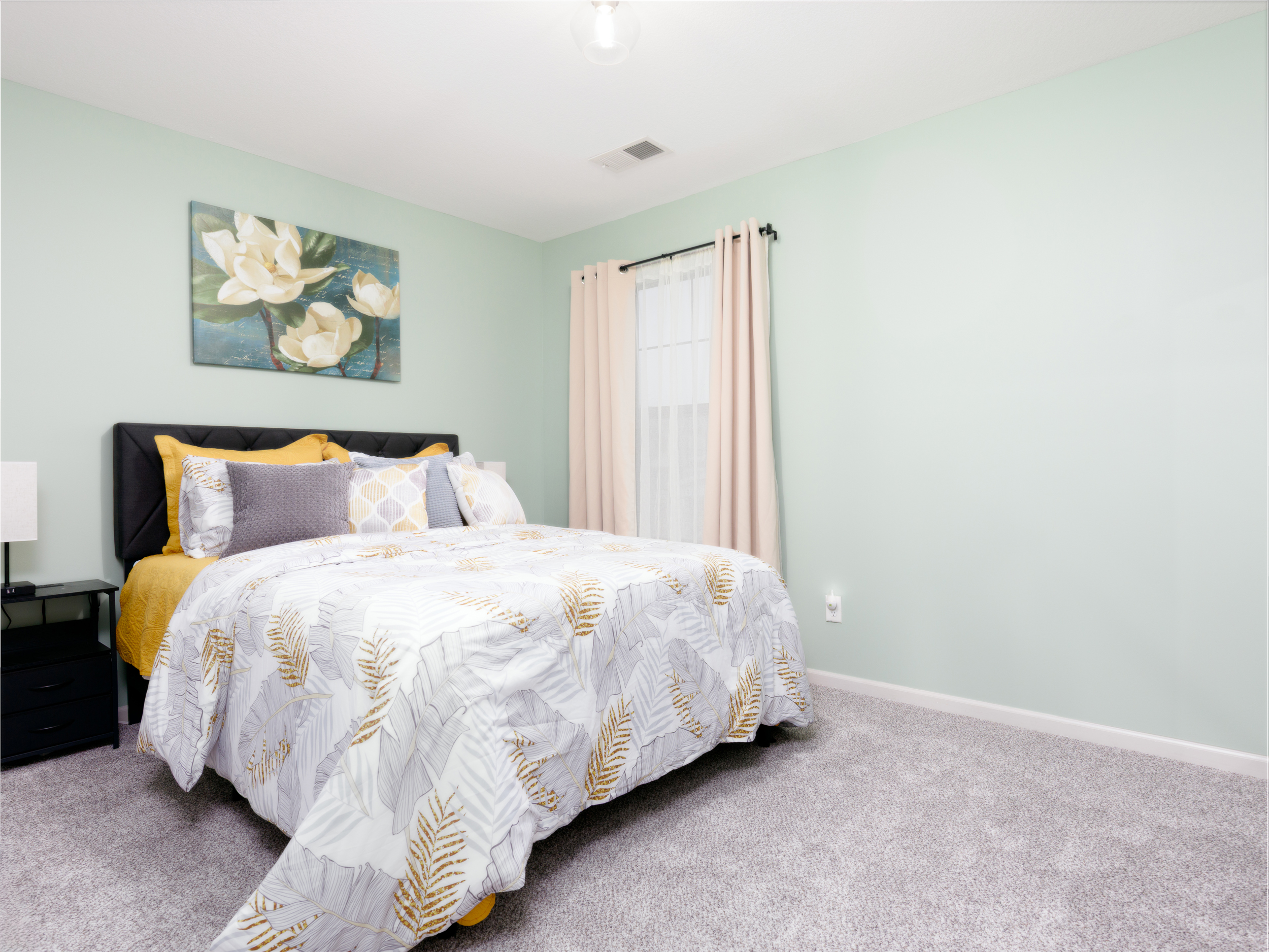 Second bedroom with a queen bed, providing a comfortable and restful retreat for guests.