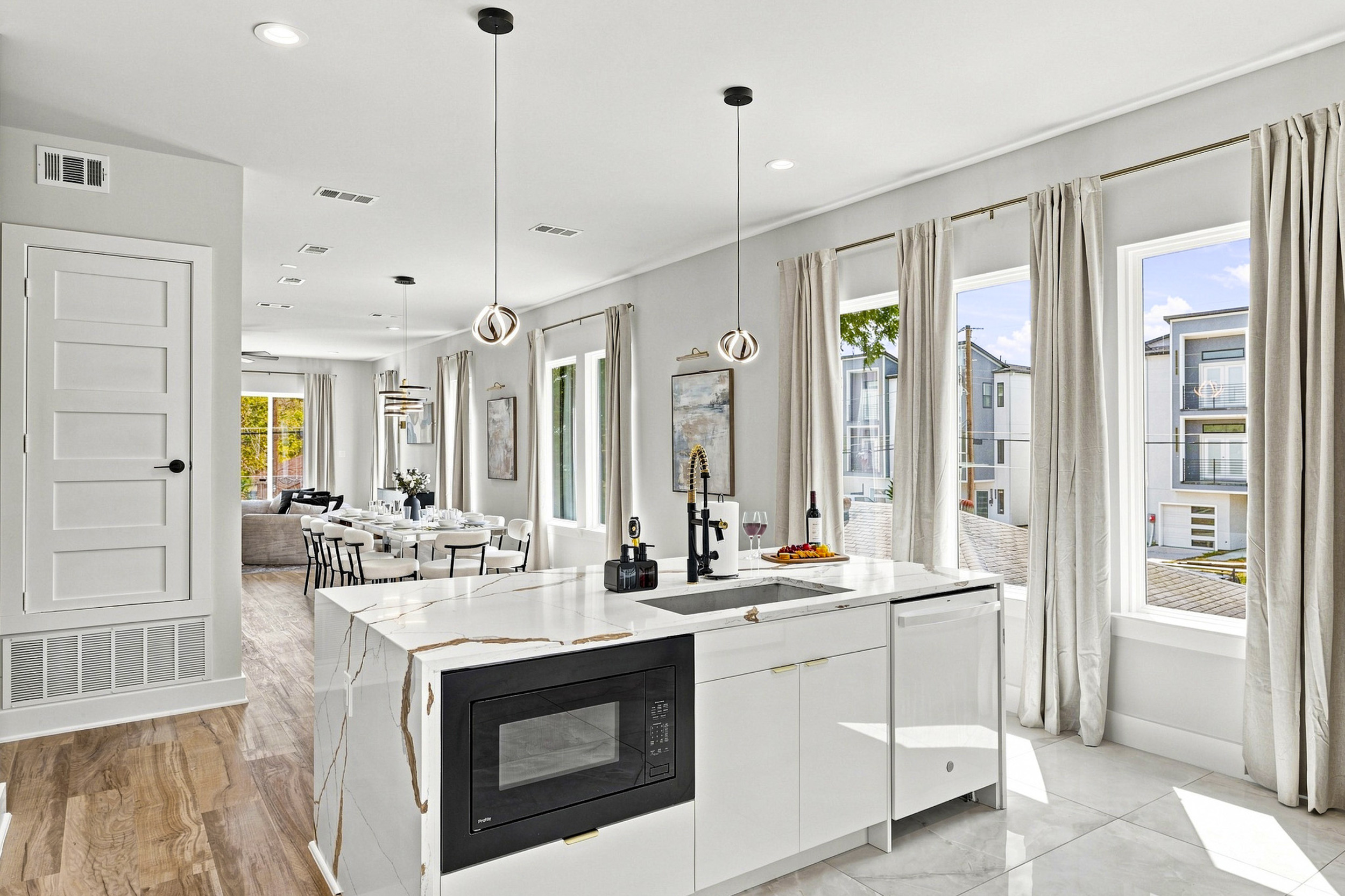 Sleek countertops and bright windows create the perfect culinary escape.