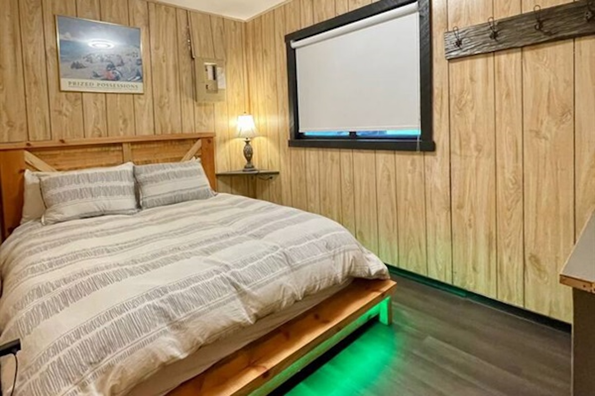Cozy bedroom with warm lighting and wood finishes