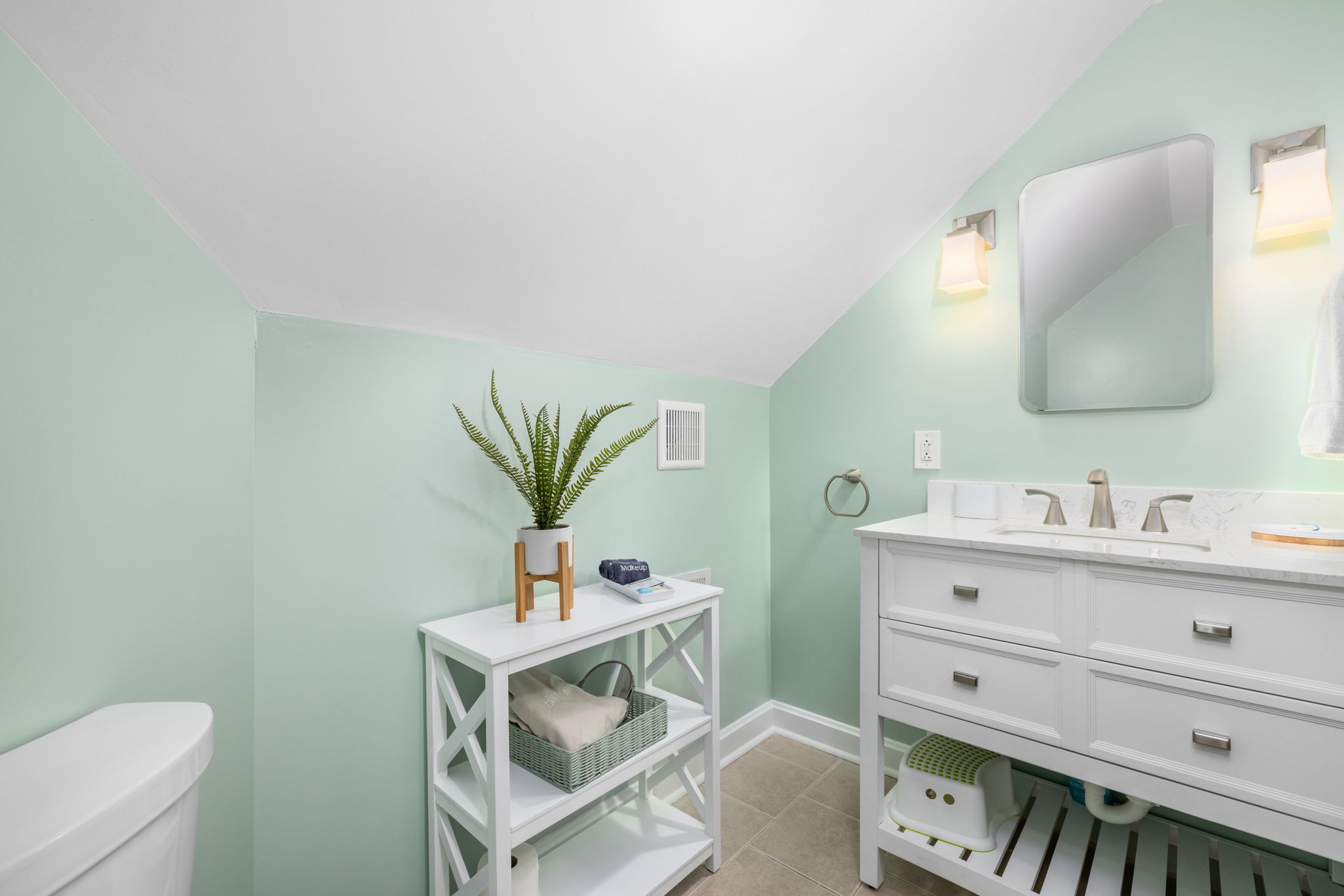 Convenient 1/2 bath for easy access for the second floor bedrooms. Step stool, medicine cabinet, vanity drawers for storage and hair dryer.