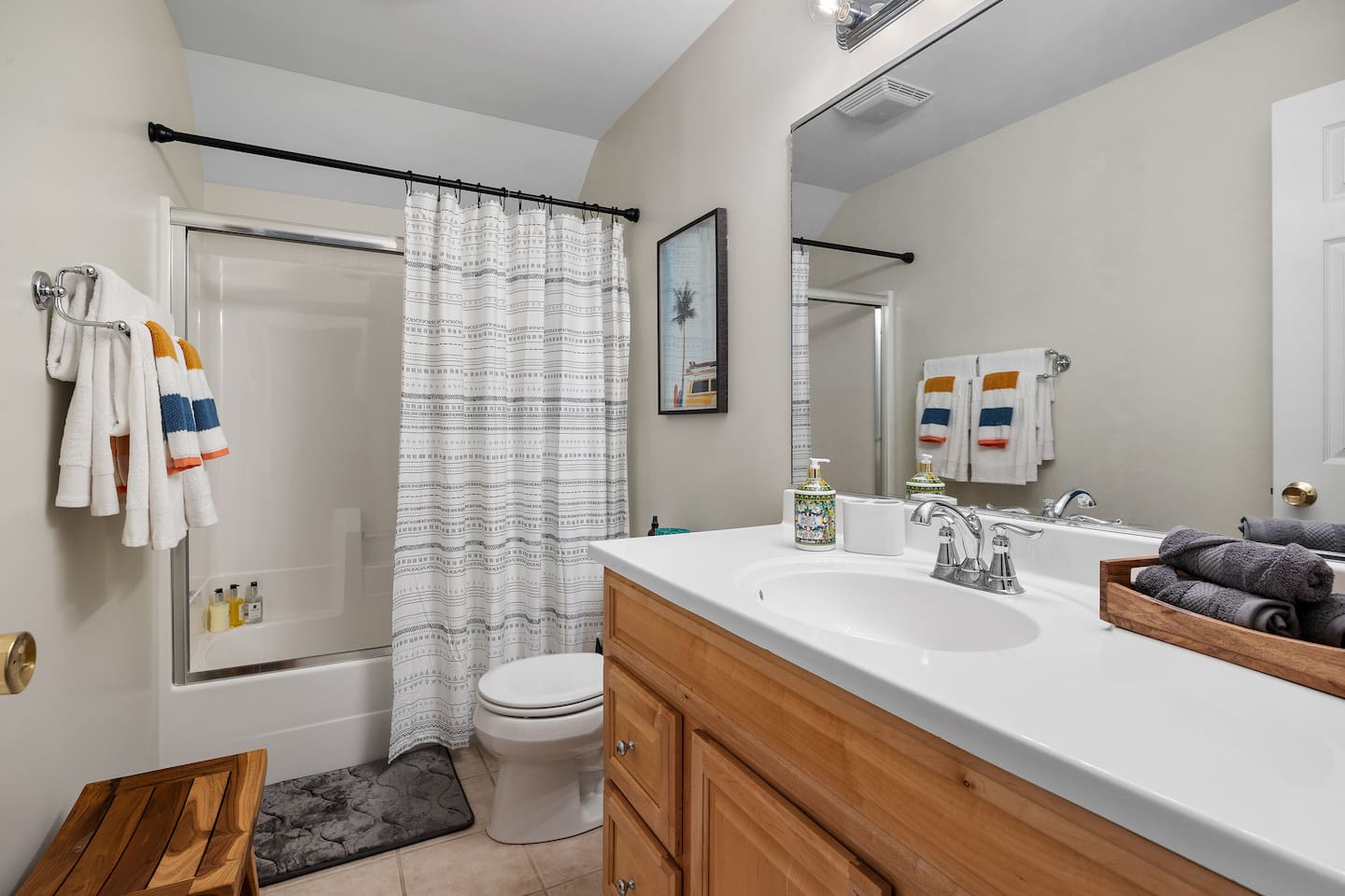 Upstairs full bathroom with tub/shower and large vanity.