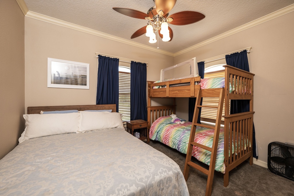 Secondary bedroom with queen bed and twin over twin bunk bed