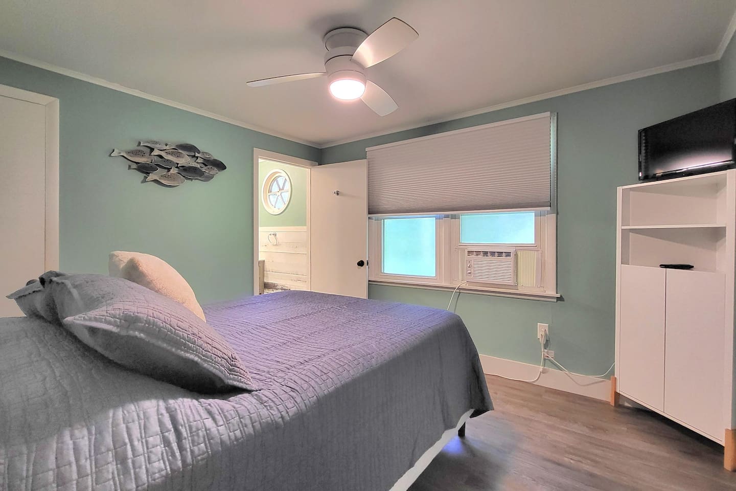 Primary bedroom with queen bedroom and full bath