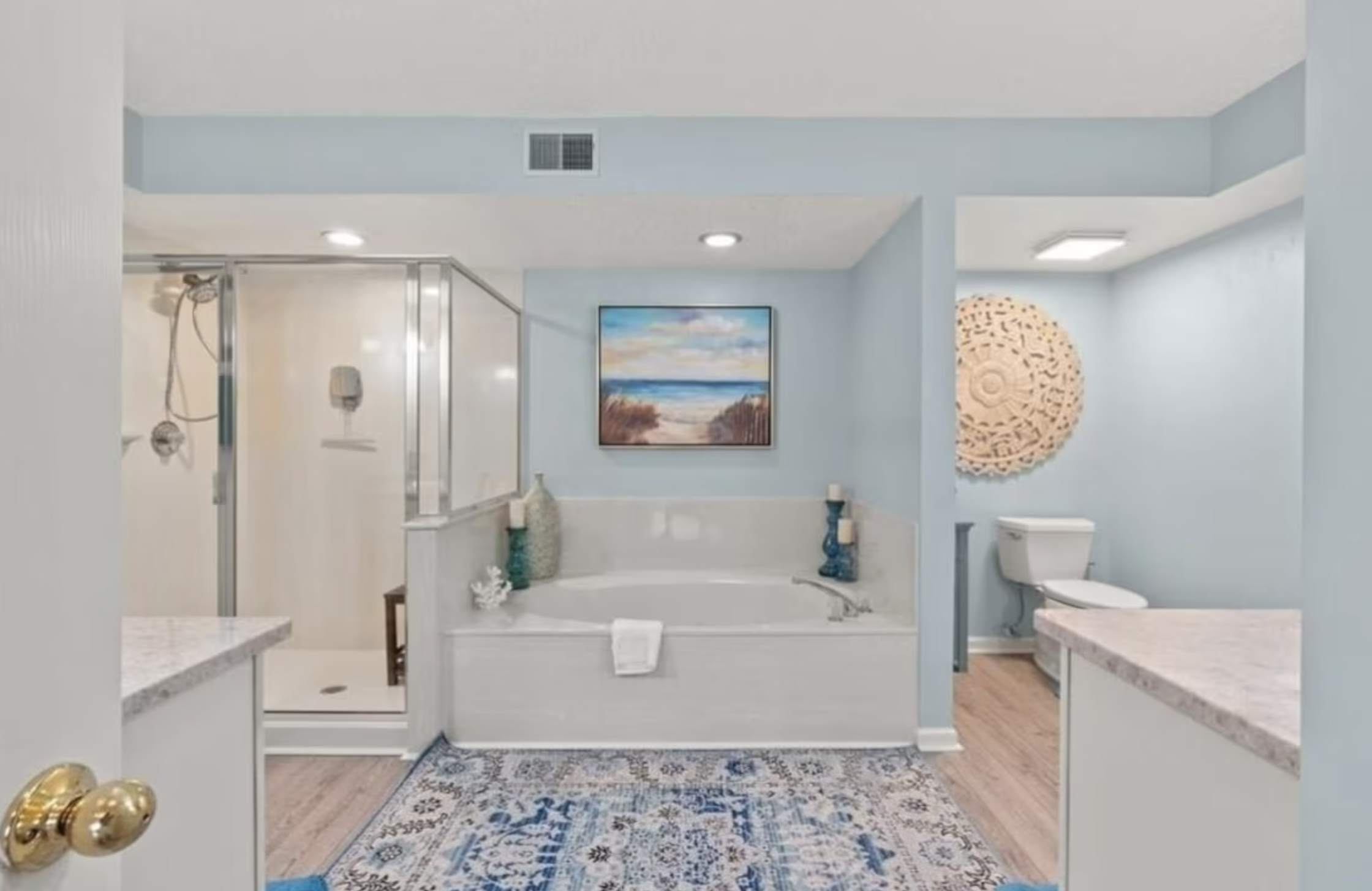 The primary ensuite bathroom has a large step-in shower, a jacuzzi tub, and 2 separate sinks and counterspaces.