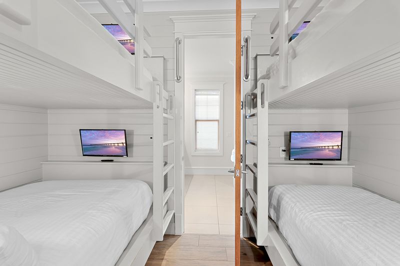 Hallway bunk area (Third Floor): Additional sleeping with queen-over-queen and twin-over-twin bunk beds, shared bathroom 