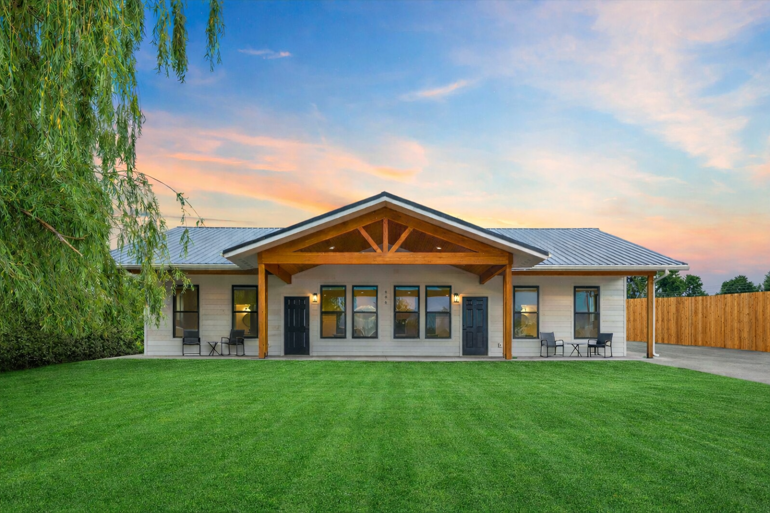 Large covered patio with extendable divider for extra privacy when when the other unit is occupied.