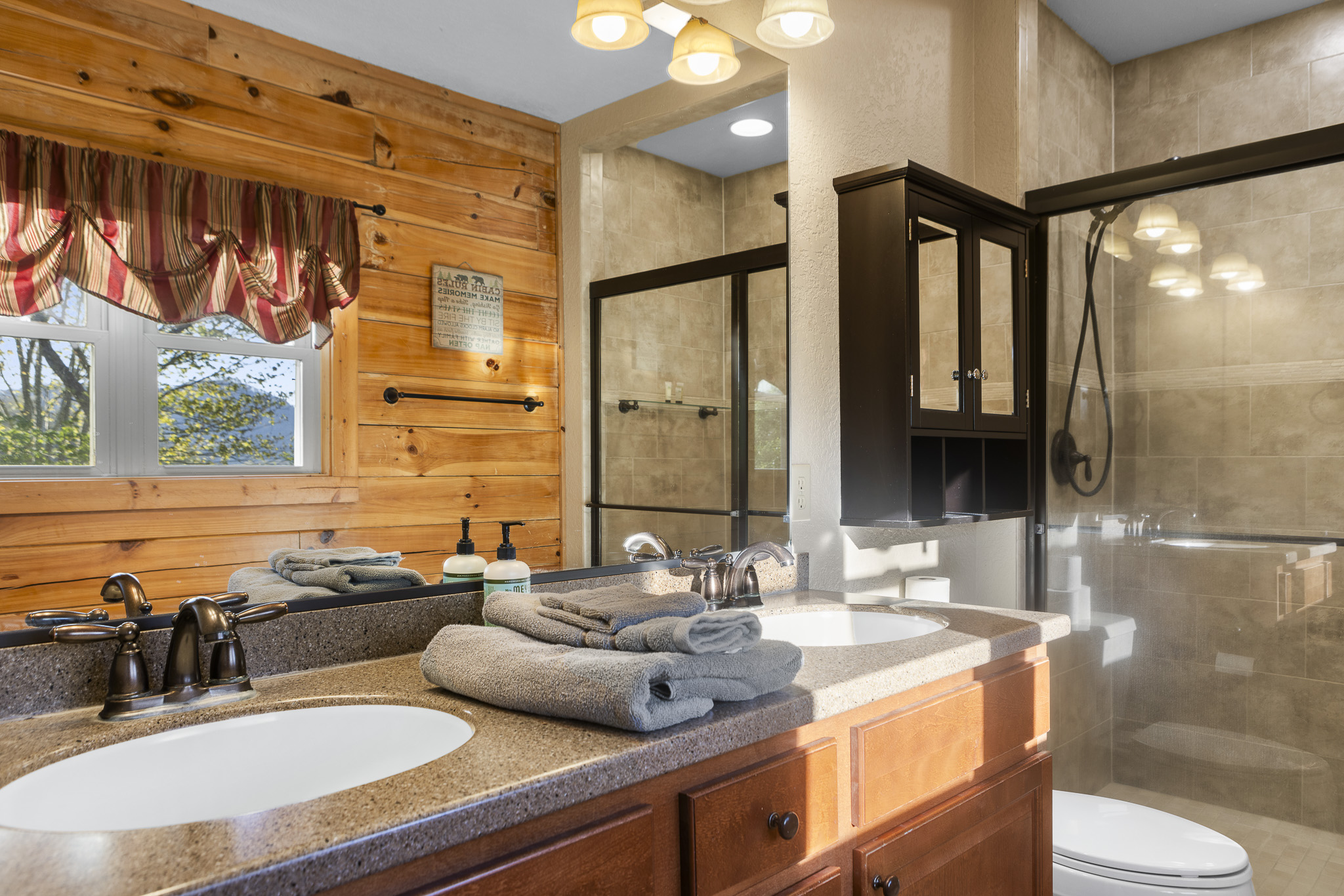Bathroom: Elegant dual sinks in a sunlit space, with mountain views to enhance your pampering!