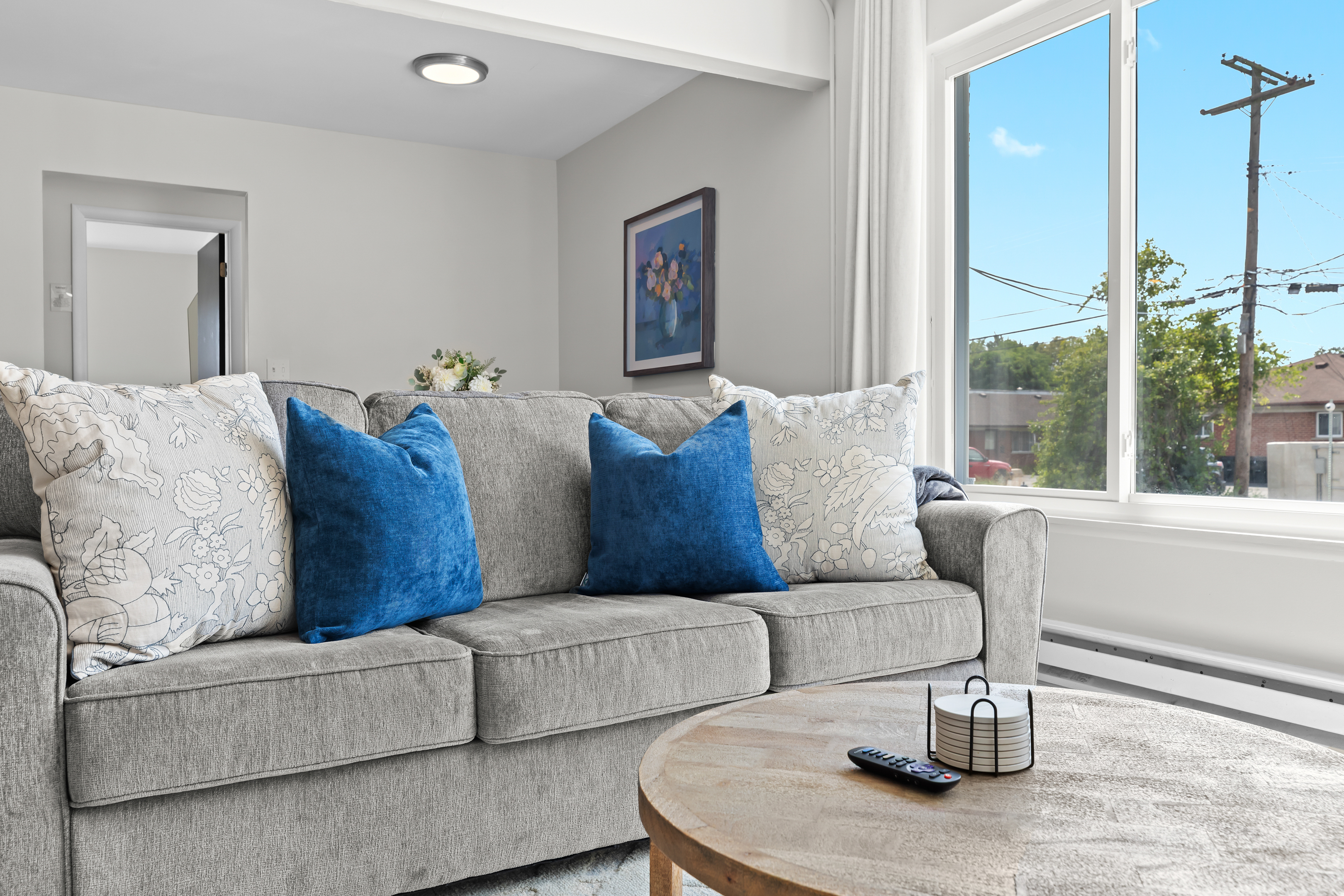 Plush seating with accent pillows, perfect for relaxing after a day out.