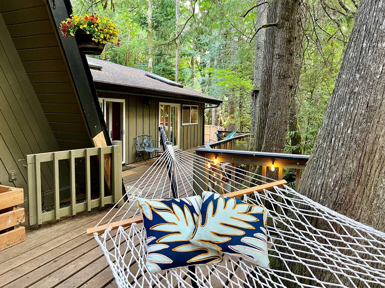 Back Deck on main floor level, overlooking the Sandy River. Access from Main Level Living Room, Master Bedroom, and King Size Guest Bedroom.