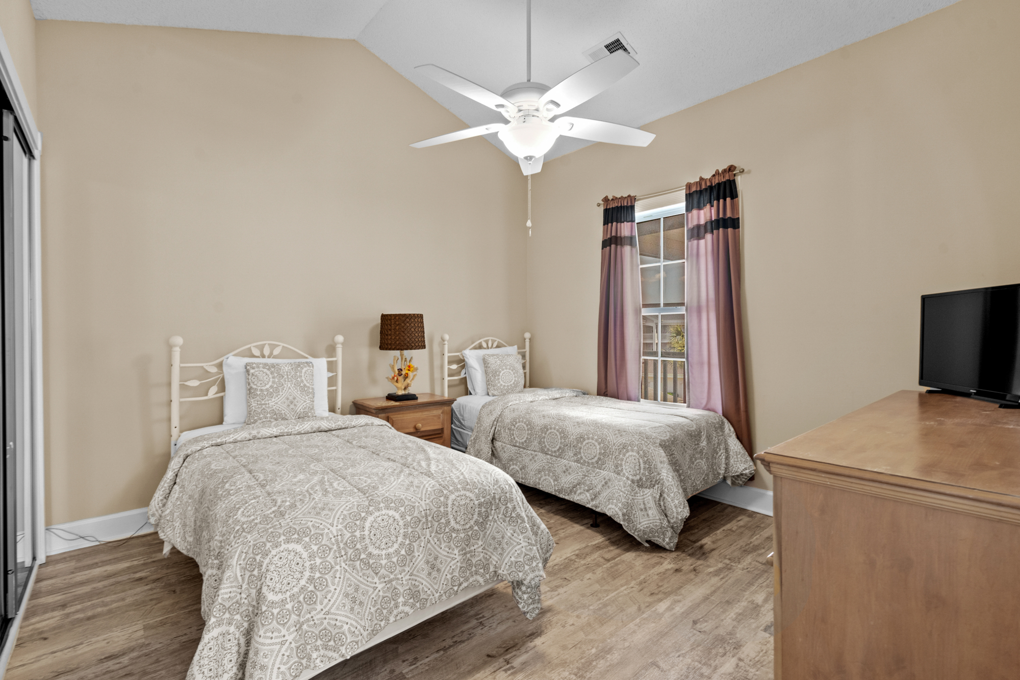 Third Bedroom with 2 Twin Beds, TV, and Storage