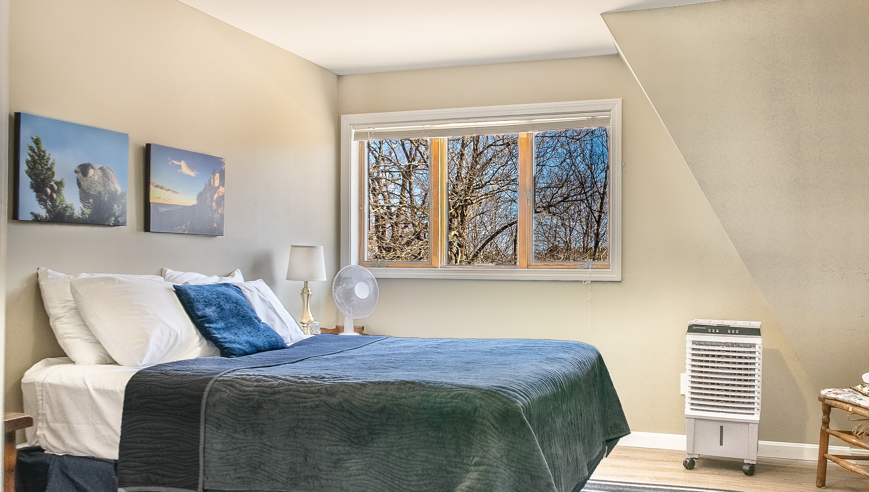 Beat the Maine humidity with our newly installed climate control. This queen guest room features a dedicated windowless AC unit, ensuring a cool, restful retreat after a day of hiking—an elevated comfort rarely found in historic maritime lofts.