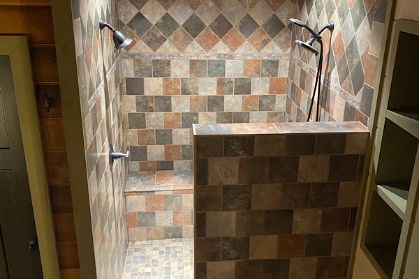 Walk-in shower with slate tile and 2 shower heads!