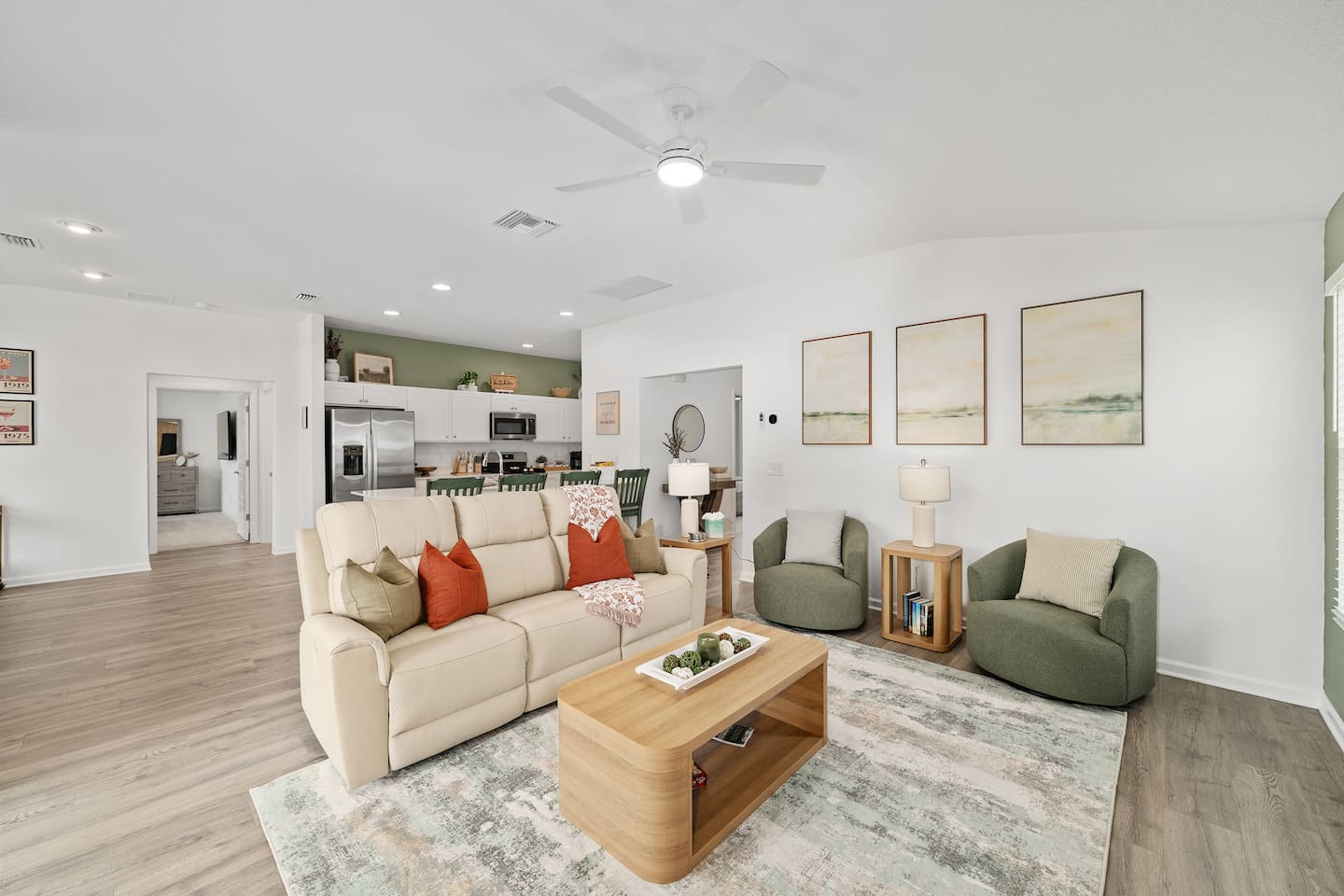 Spacious open living area to relax, enjoy and unwind.  The living room features a power reclining sofa, two swivel accent chairs, and some books to enjoy!