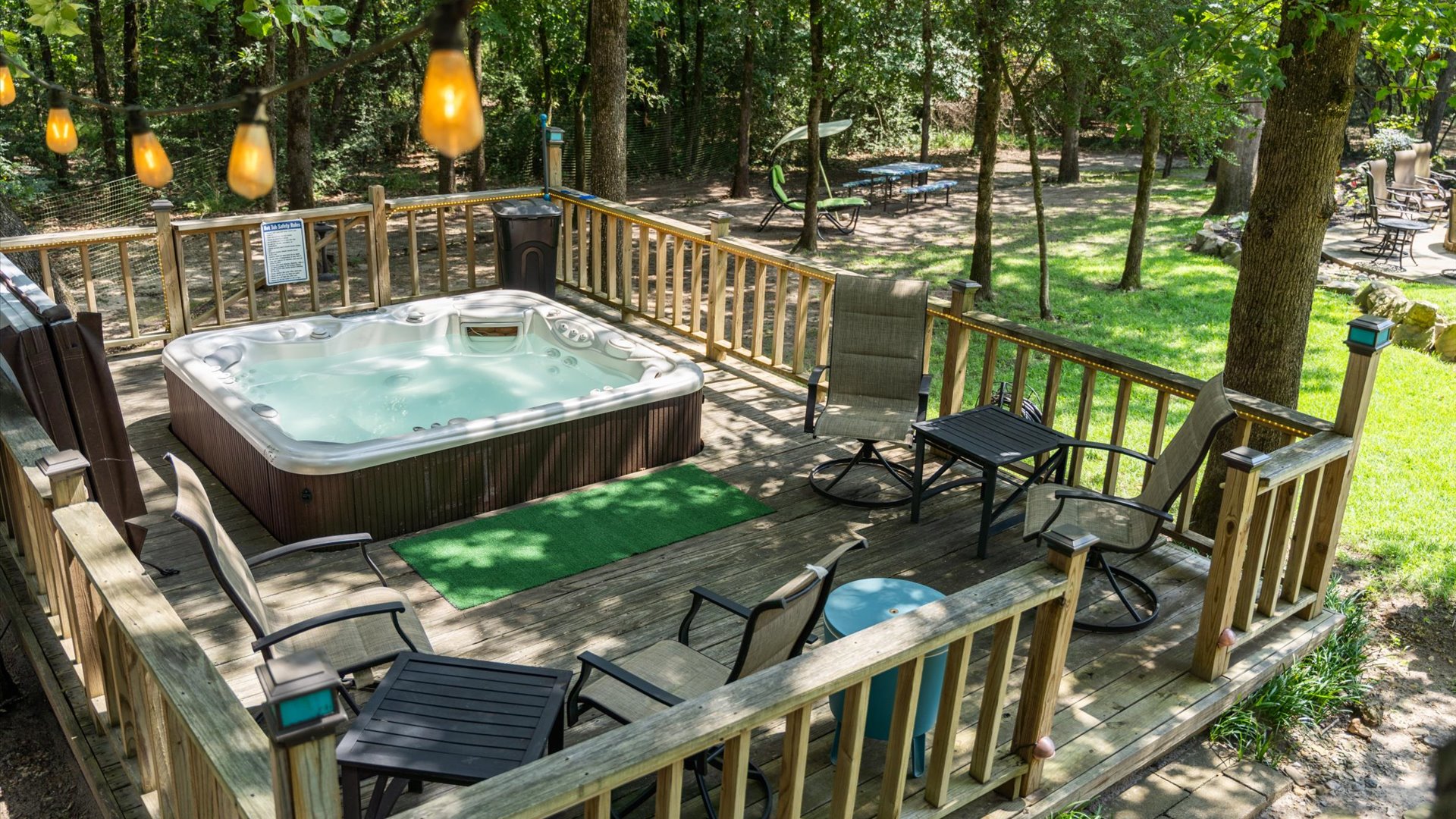 The hot tub area is spacious and thoughtfully designed—not just for soaking, but for socializing too! With plenty of seating nearby, it’s the perfect place to unwind and conversate.
