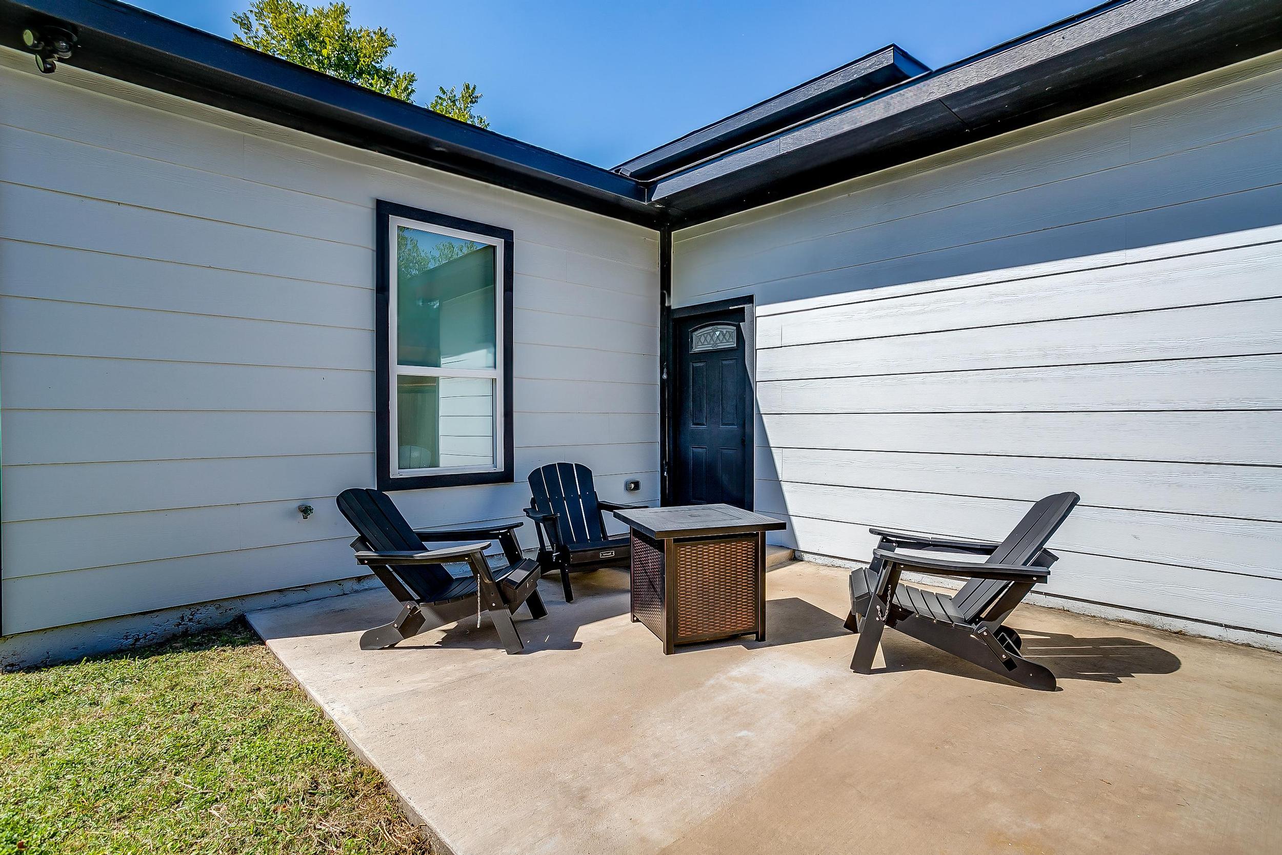 Backyard seating area with firepit—great for relaxing evenings.