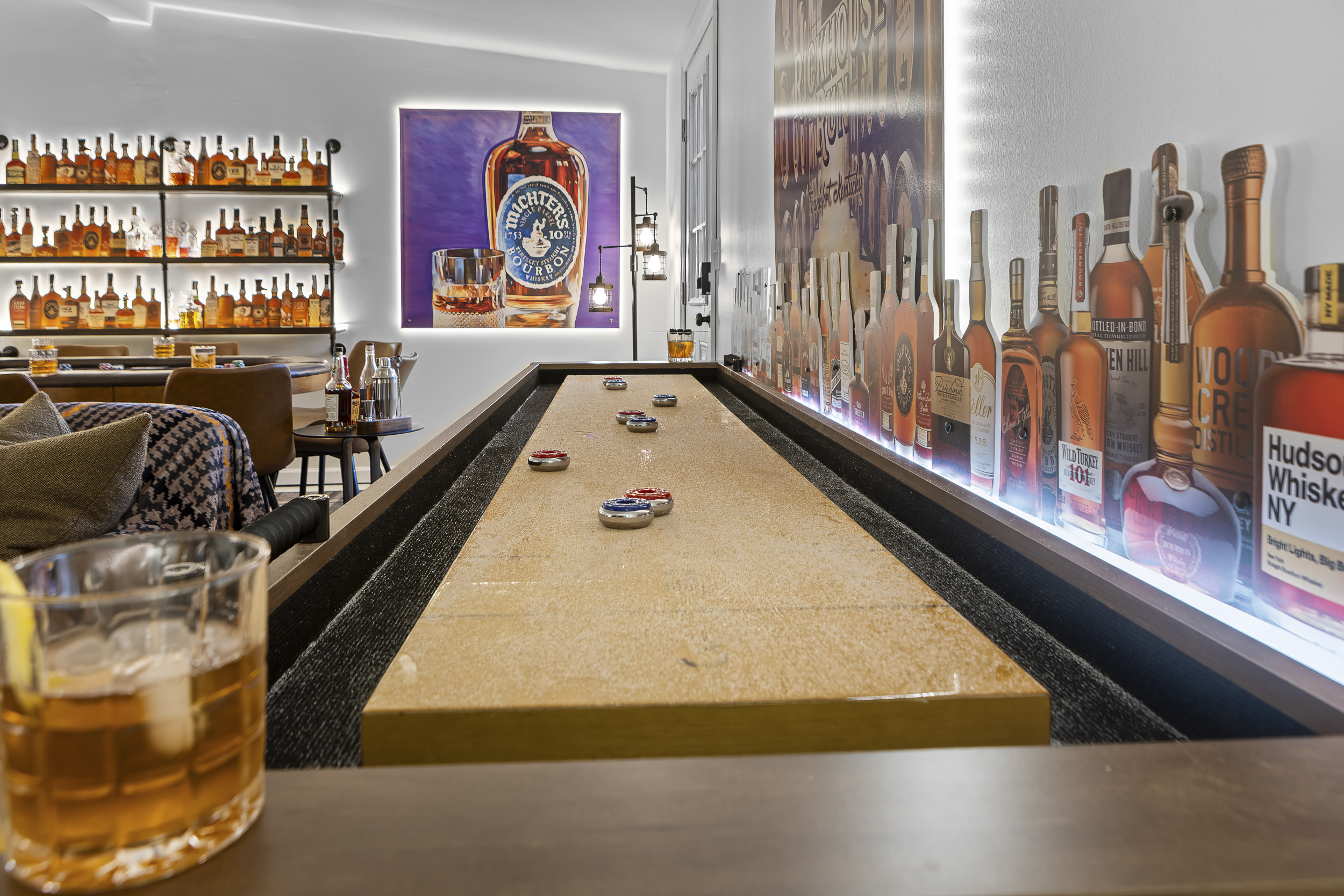 Challenge the crew to a game on the full-length shuffleboard table, with a glass of bourbon never far from reach.