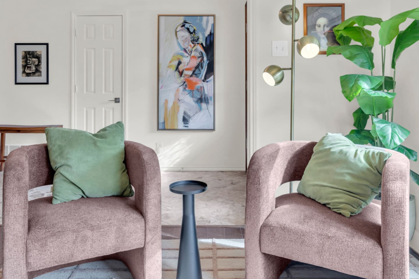 Sitting area with two comfortable chairs, offering a cozy spot for conversation, reading, or relaxing in a quiet corner of the home.