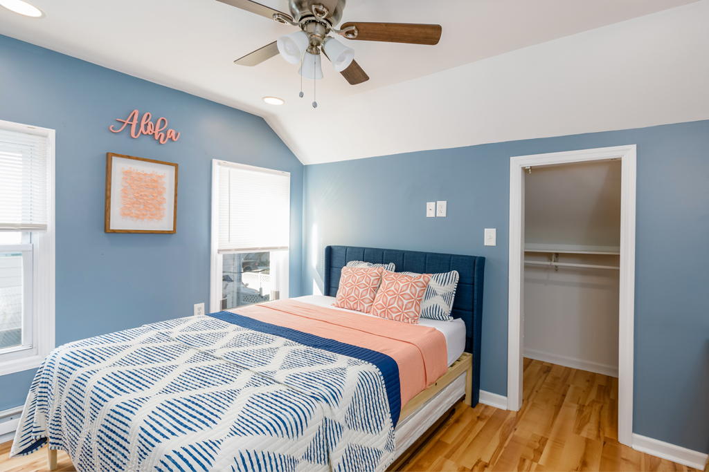 Get some R&R in this primary second floor bedroom with room darkening shades and a smart TV.