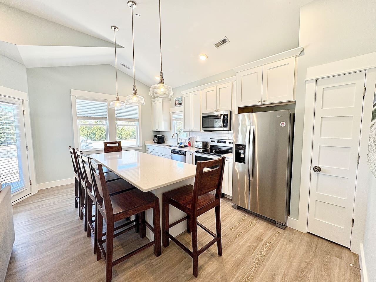 Spacious kitchen with island seating and stainless steel appliances