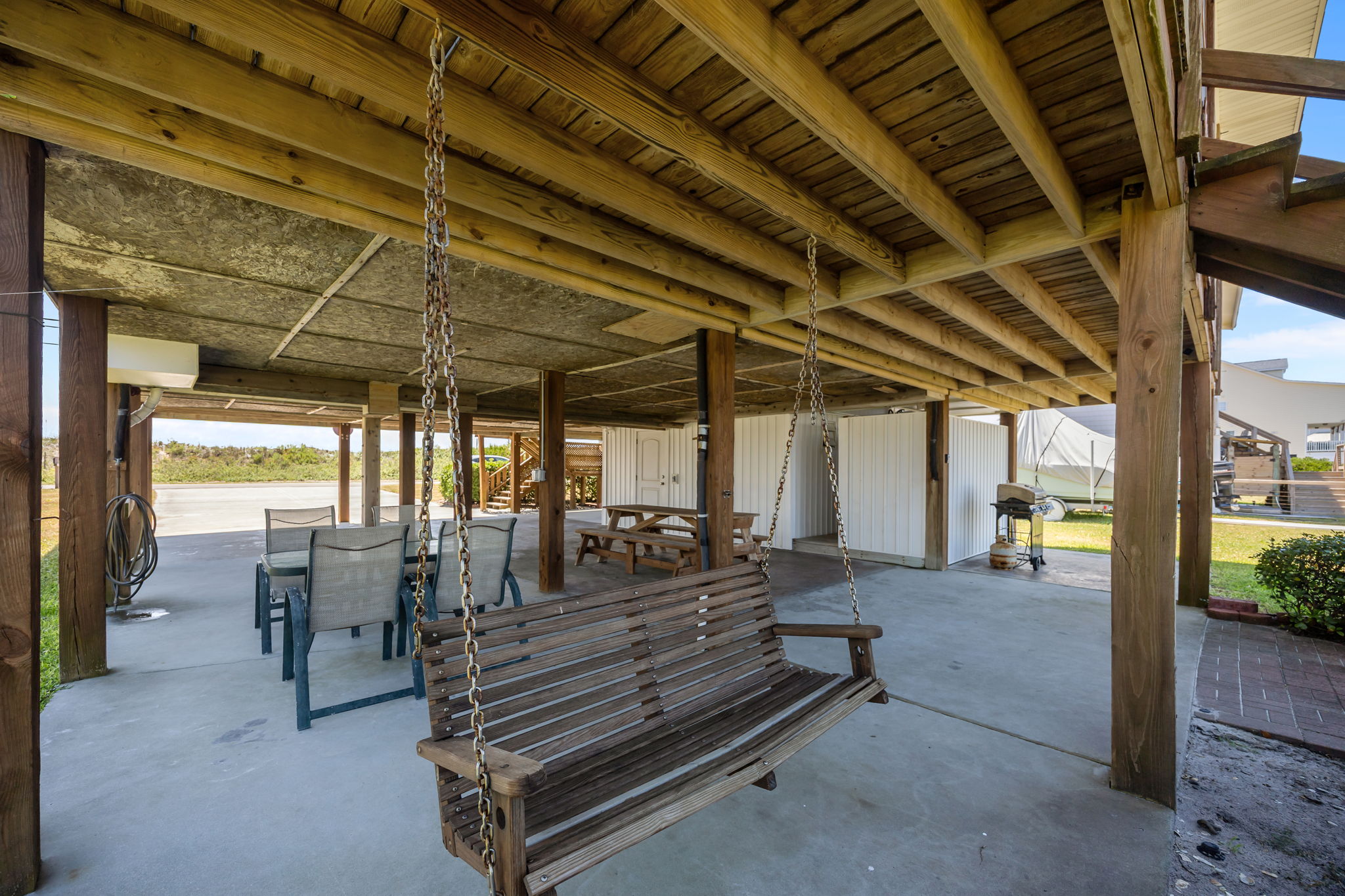 A relaxed, breezy space beneath the house — perfect for hanging out anytime