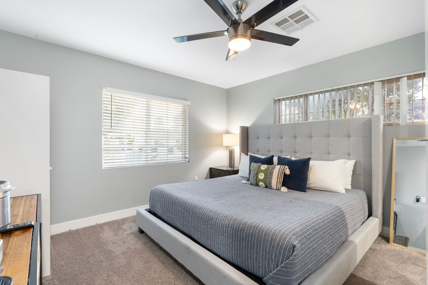Spacious queen-sized bedroom, offering ample room for relaxation and comfort with a stylish and cozy atmosphere.