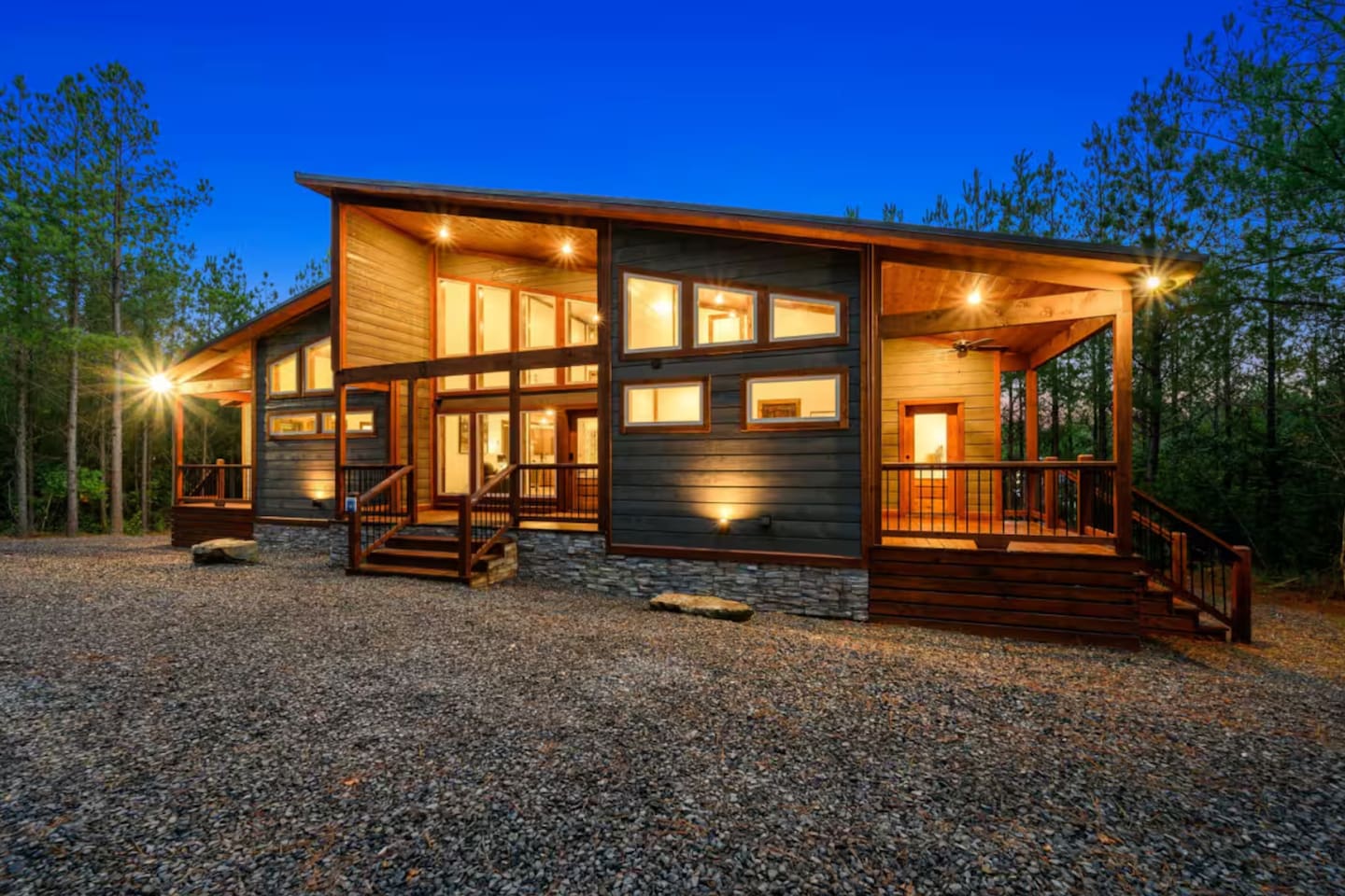 Welcome to Redfern Retreat, a picture-perfect luxury cabin tucked beneath towering pines—complete with covered decks, forest views, and rustic-modern charm from every angle.